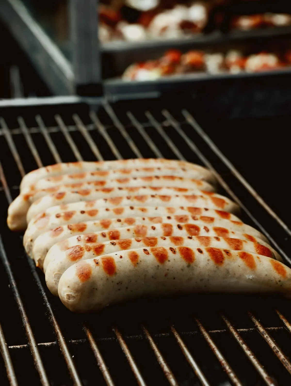 Sausages browning on a grill