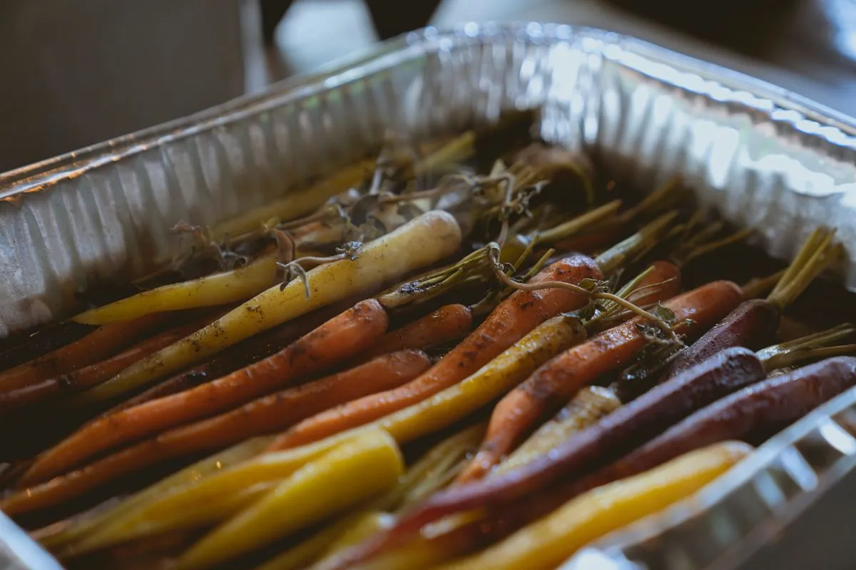 Grilled carrots on a metal tray