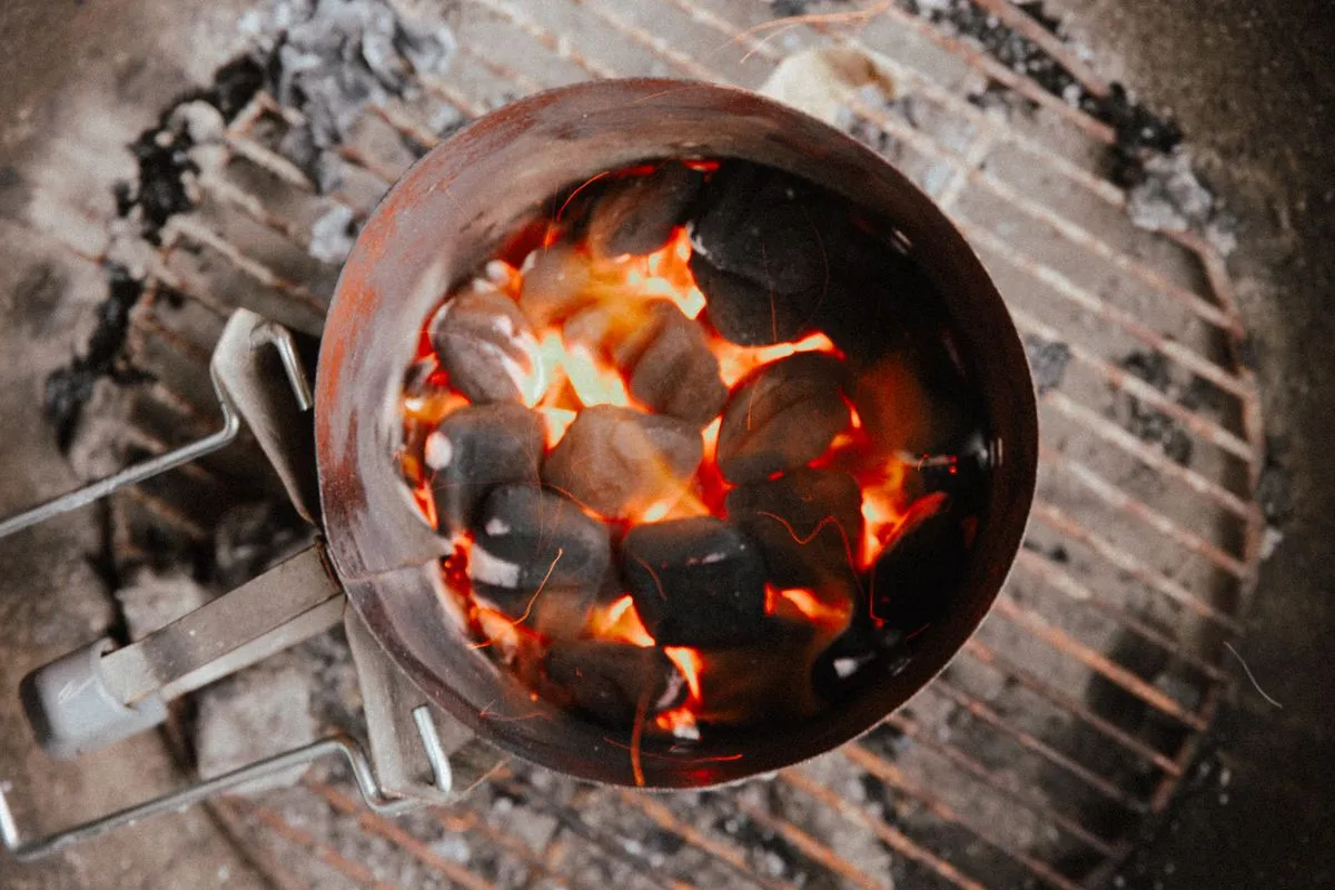 Glowing charcoal briquettes in a grill