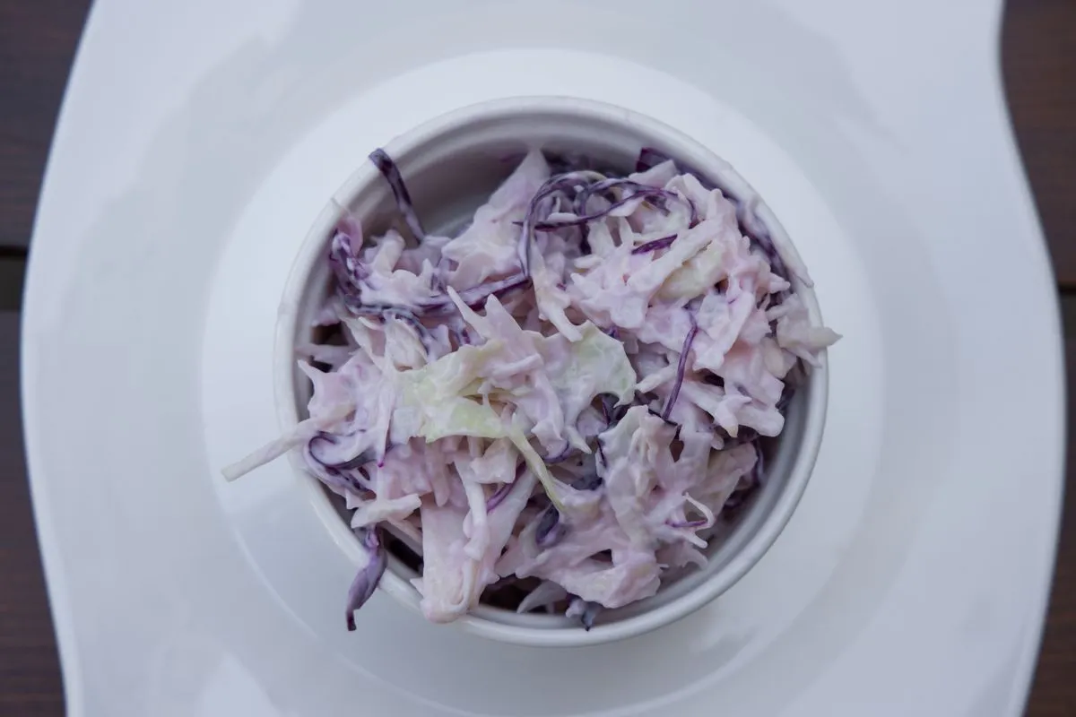 Shredded vegetable salad in a white bowl