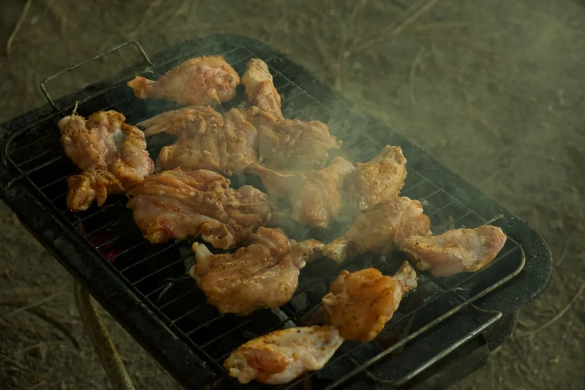 Chicken wings over glowing charcoal