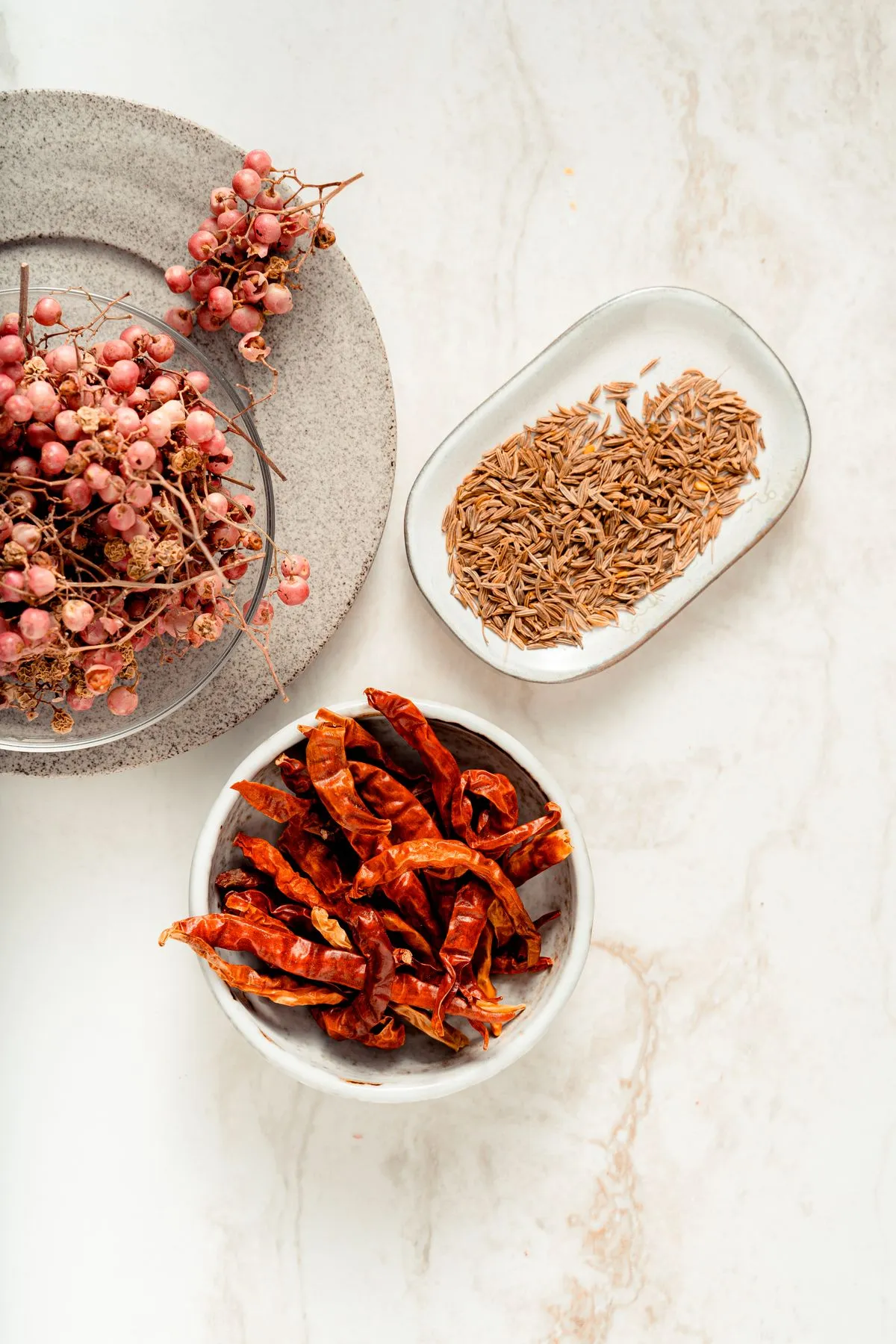 Dried spices arranged in ceramic dishes