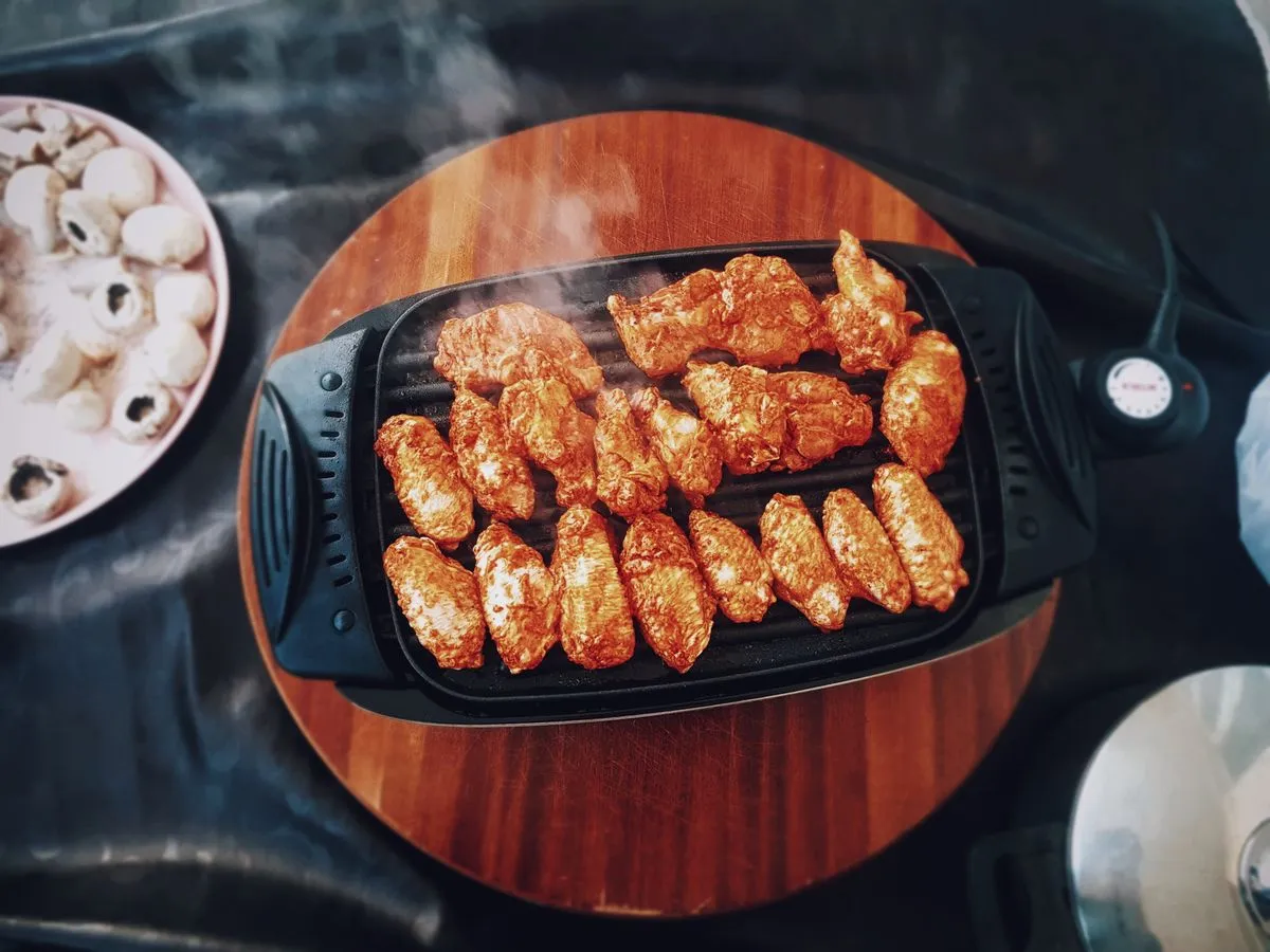 Food cooking on an electric grill