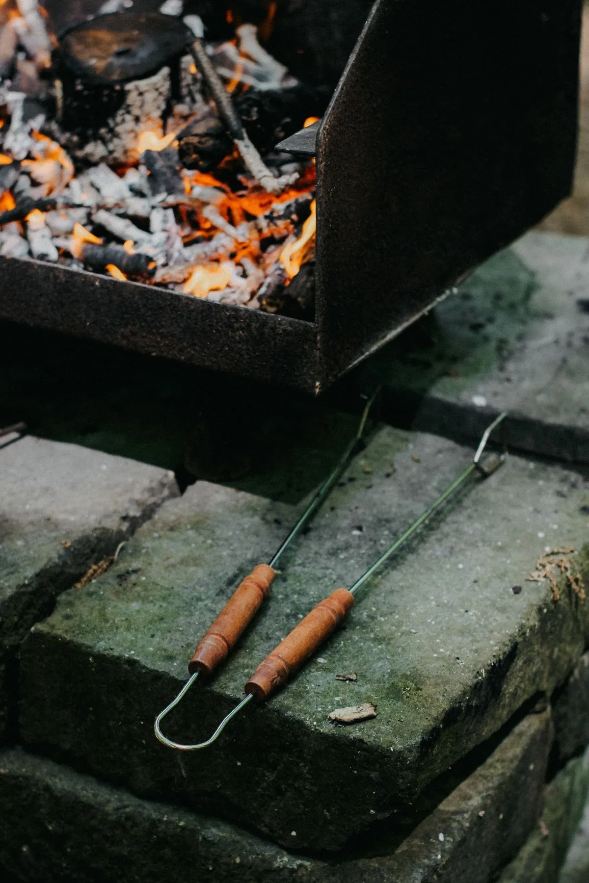 Grill tongs beside a barbecue