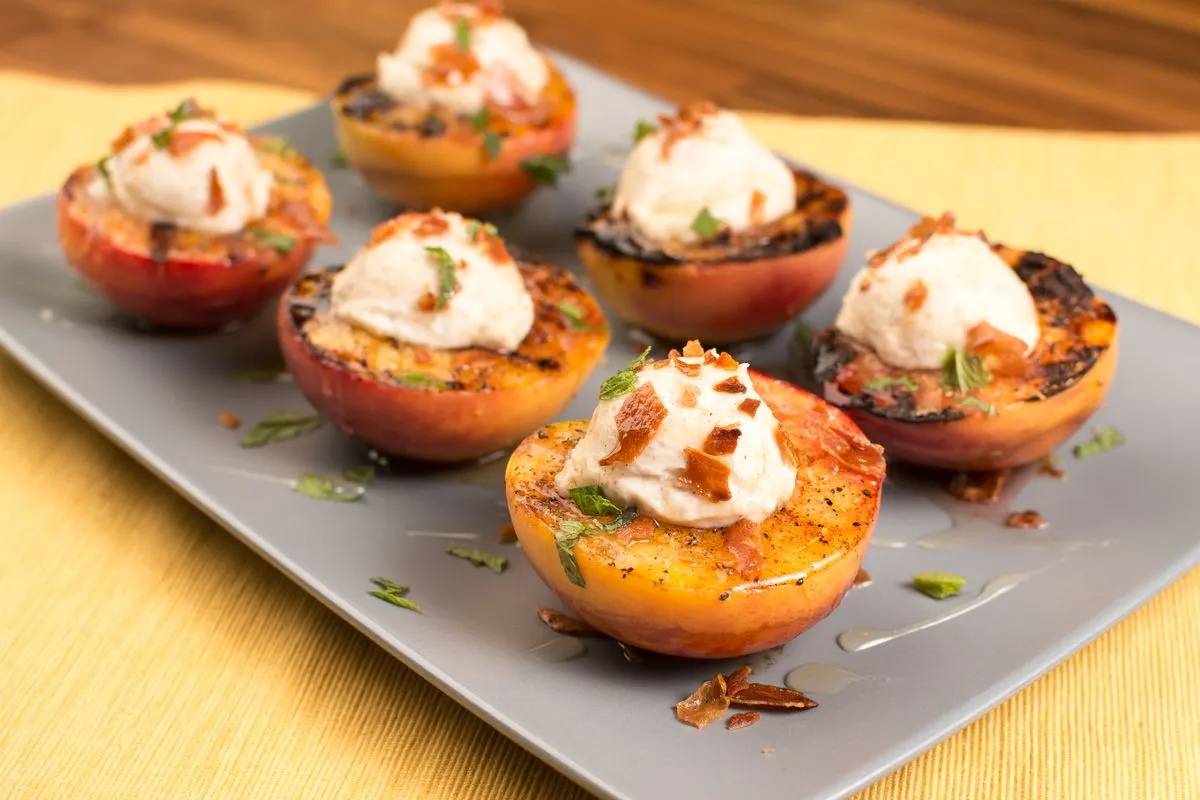 Grilled peaches on a ceramic plate