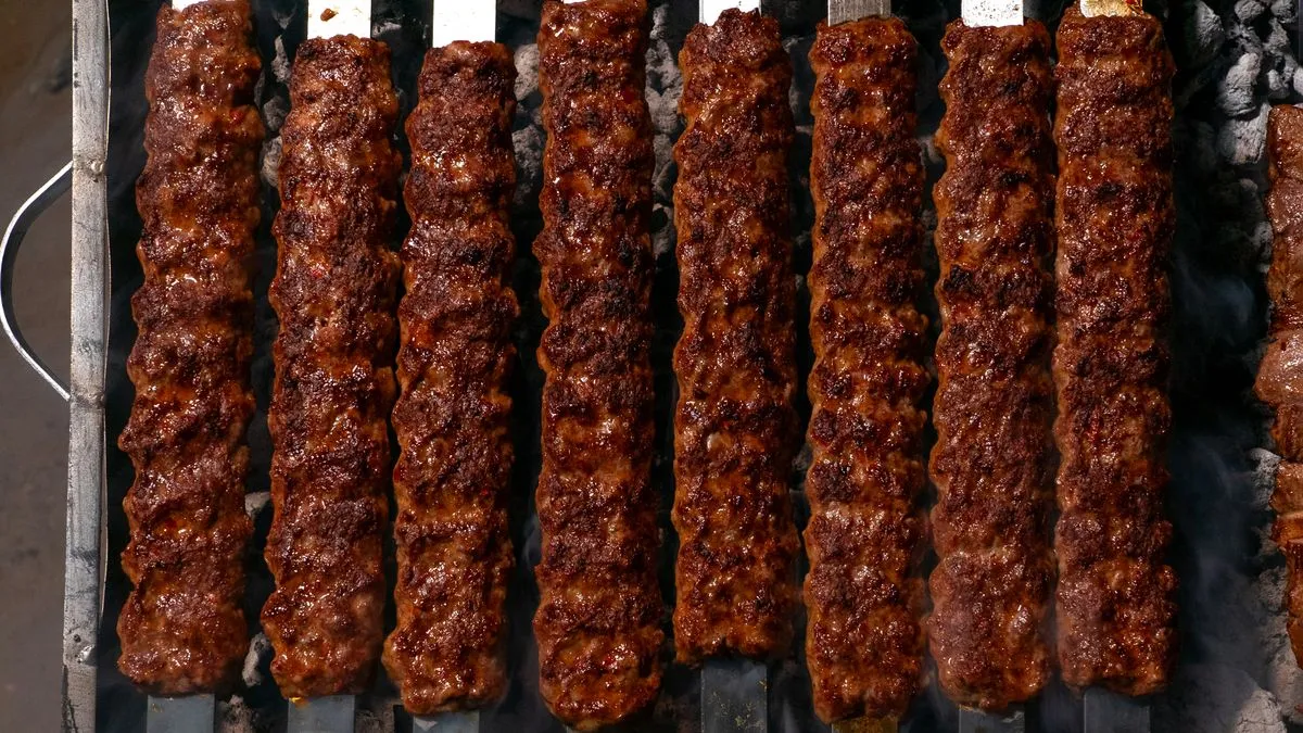 Grilled minced-meat kofta on flat skewers
