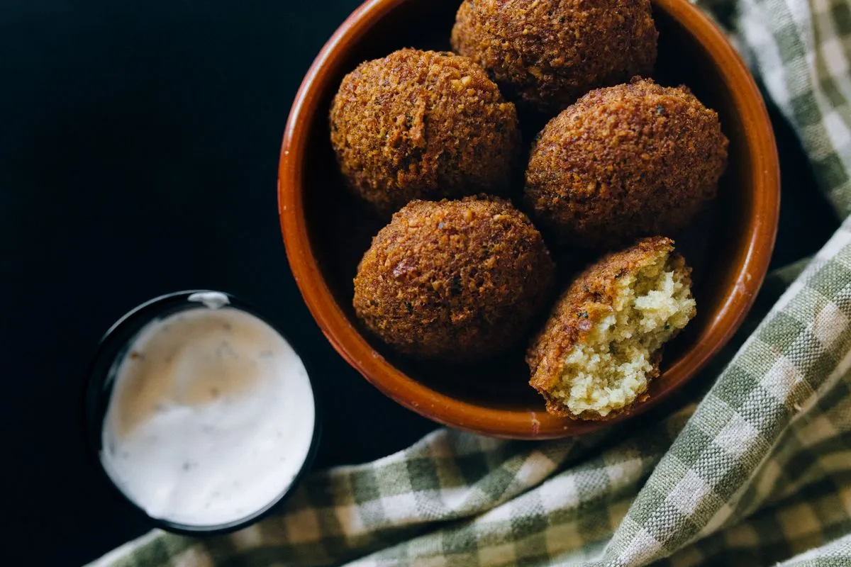Tahini sauce served beside falafel