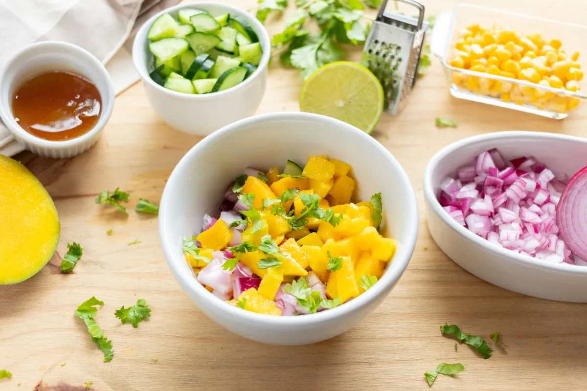 Fresh mango salsa with its ingredients