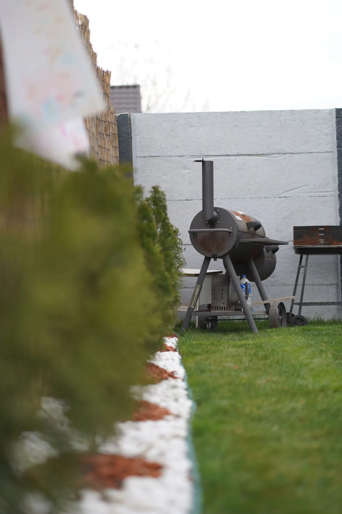 Barbecue positioned in a house garden