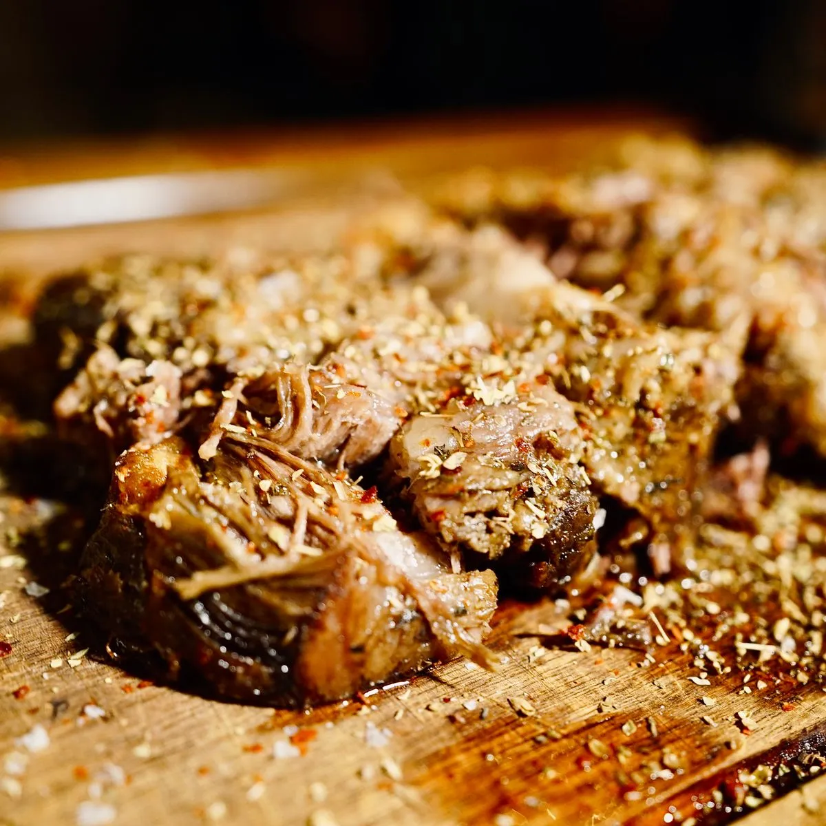 Slow-cooked pork pulled apart on a board