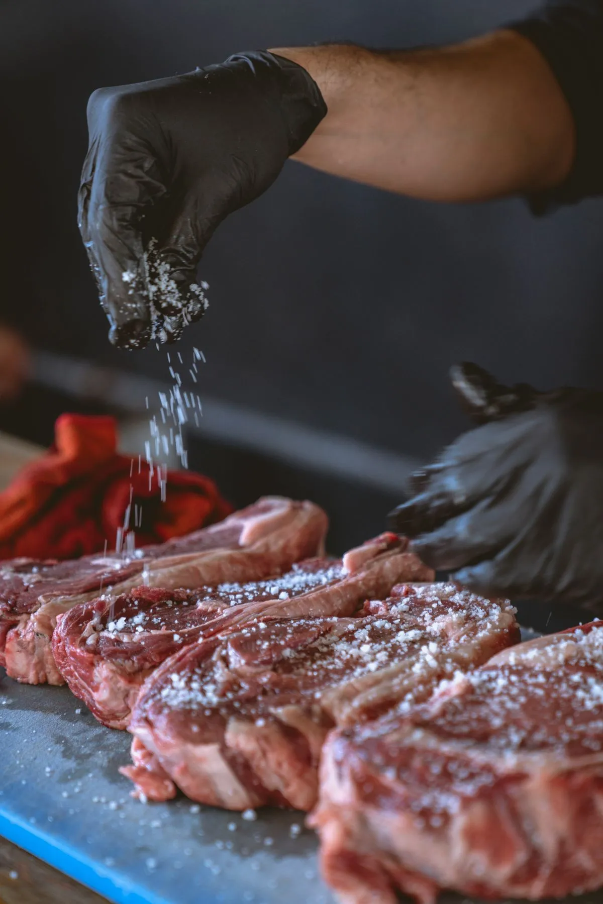 Seasoning a steak before cooking