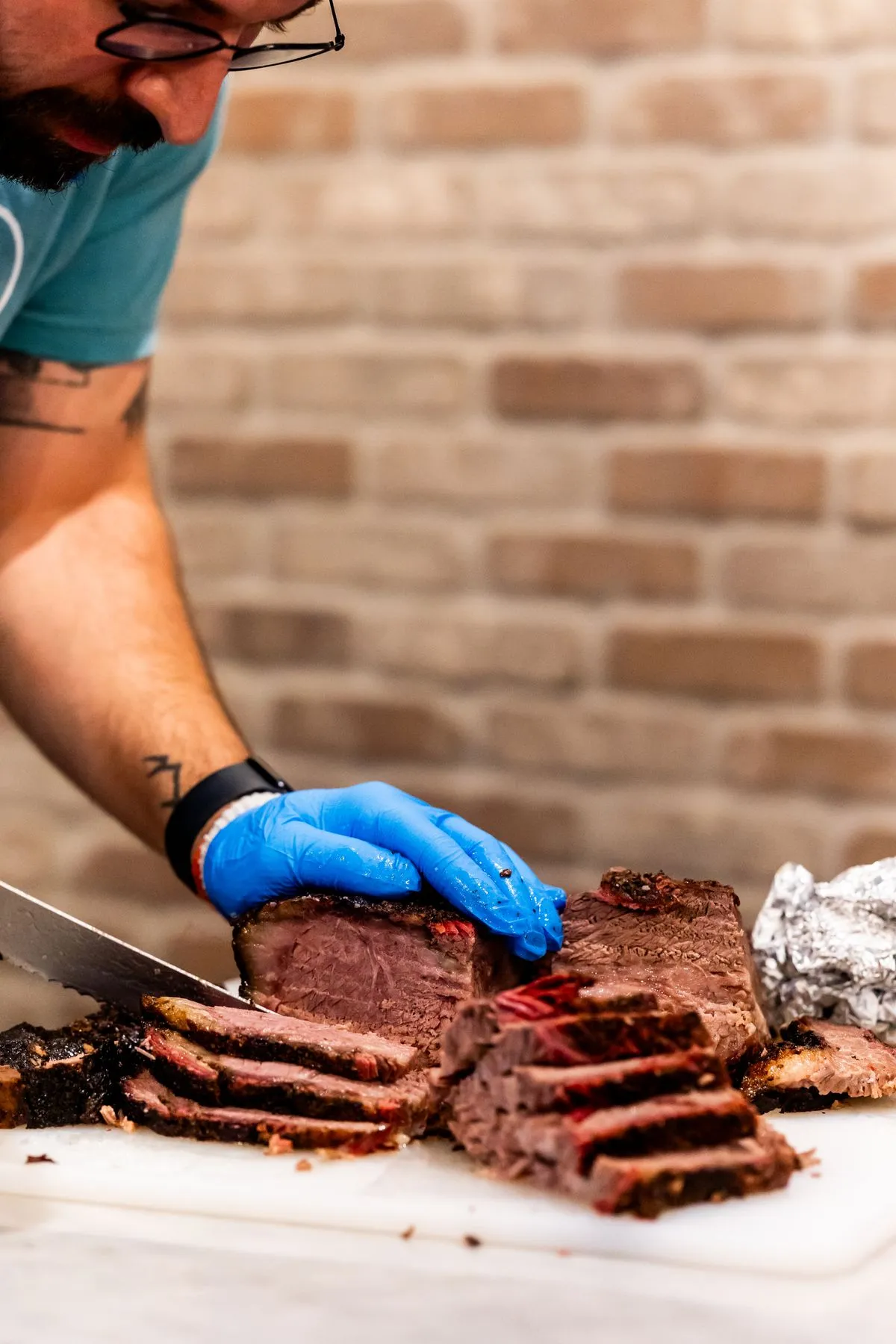 Sliced smoked brisket on a cutting board