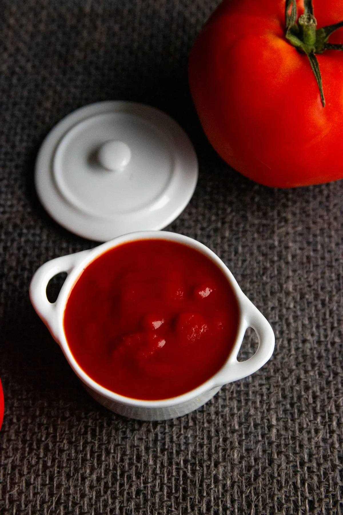 Red tomato sauce in a small ceramic bowl